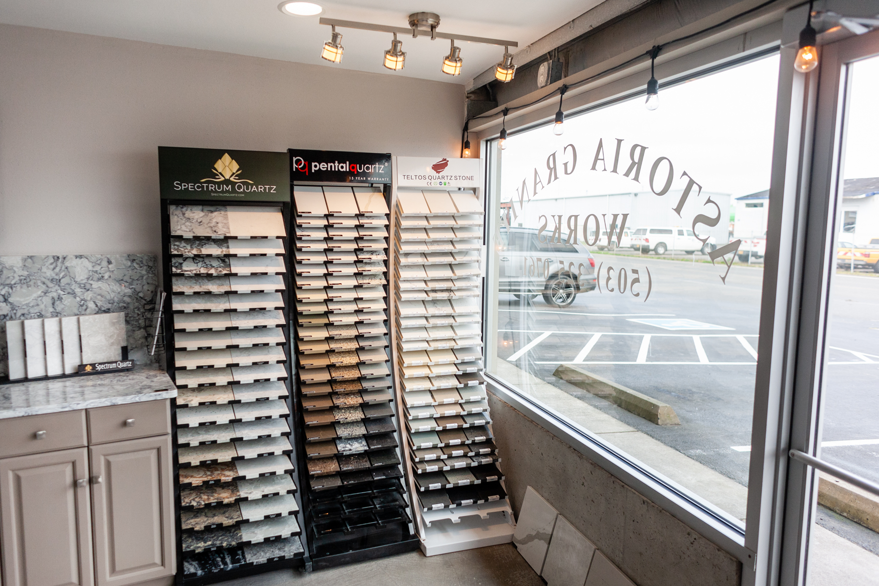 Inside the Astoria Granite Works showroom, with quartz and granite sample displays