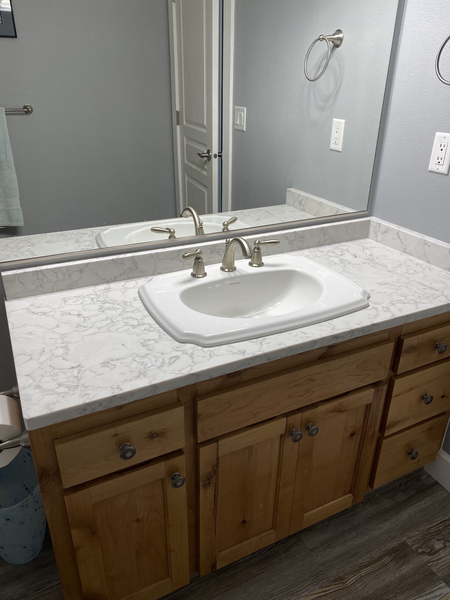 Finished bathroom vanity with marble-look countertop